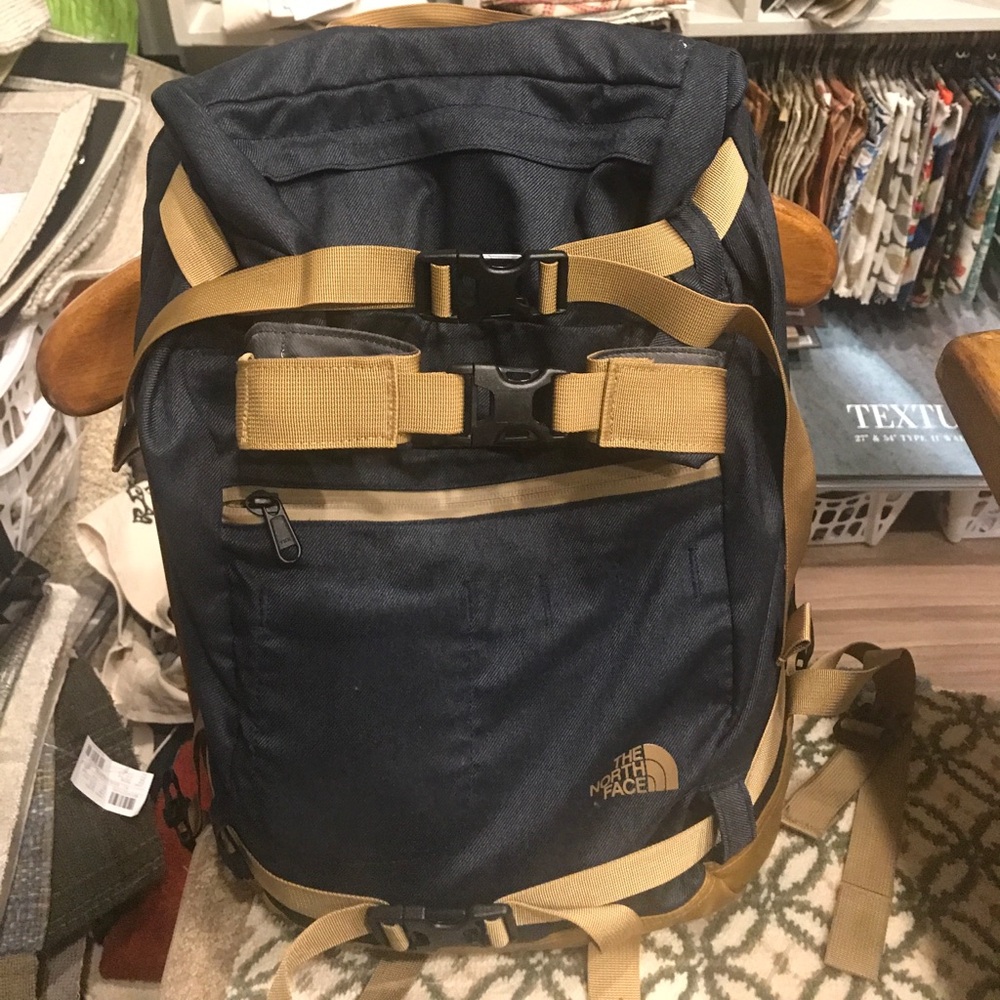 The North Face backpack in navy blue with tan accents - Unisex